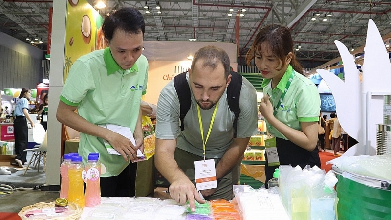International visitors learn about GC Foods products at the fair. Photo: TL