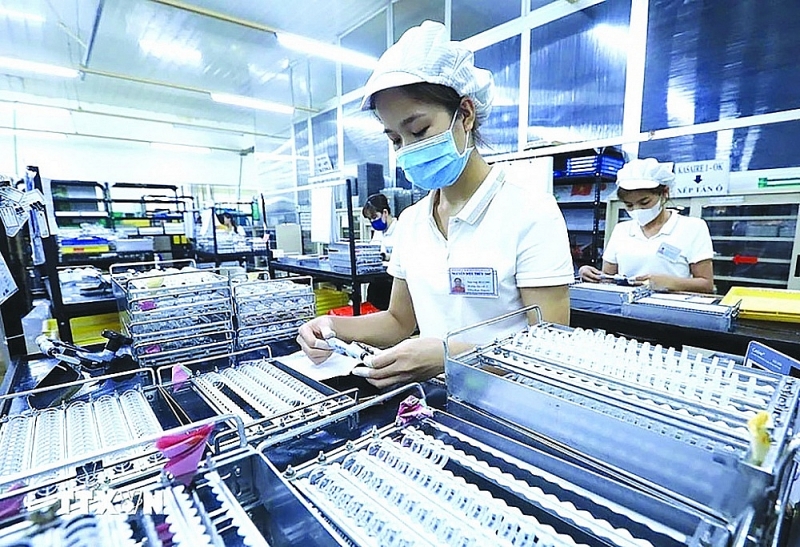 FDI investors are always interested in improving the business environment in Vietnam. (Photo: Tuan Anh/TTXVN)