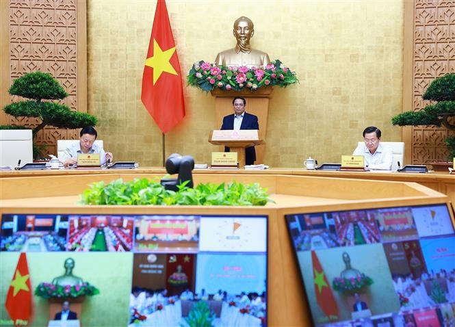 PM Pham Minh Chinh chairs the Government's regular meeting on July 6. (Photo: VNA)