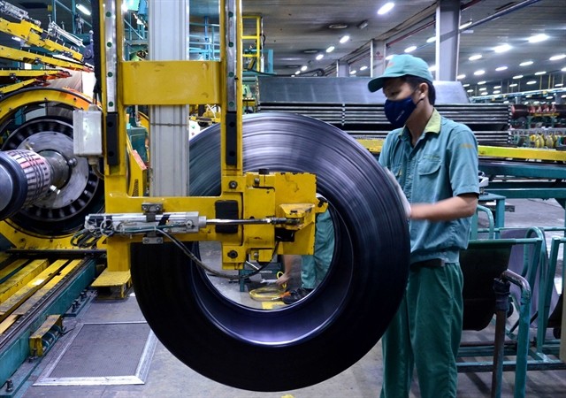 The post product inspection process at a factory of Da Nang Rubber JSC. Support policies are necessary to achieve the GDP target of 7% for the whole year. (Photo: VNA)