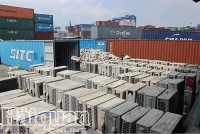 Inspecting four containers of air conditioners declared as imported fabric rolls and medium-density fiberboard