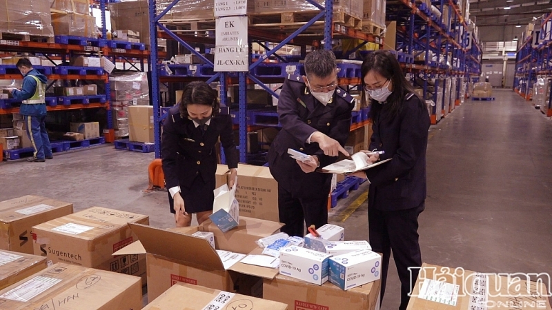 Customs officers inspect goods