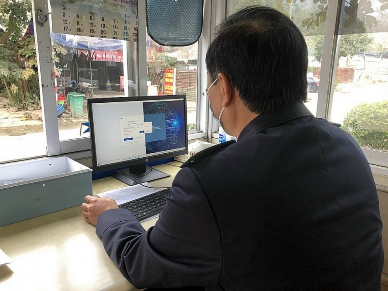 A Customs officer at Huu Nghi international border gate runs the the digital border gate platform.