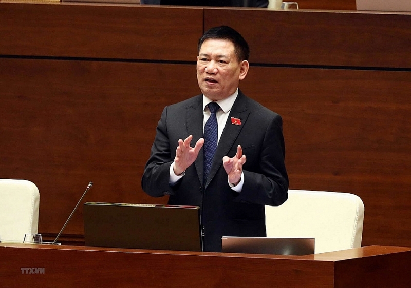 Minister of Finance Ho Duc Phoc delivered a speech at the session. Photo: VNA