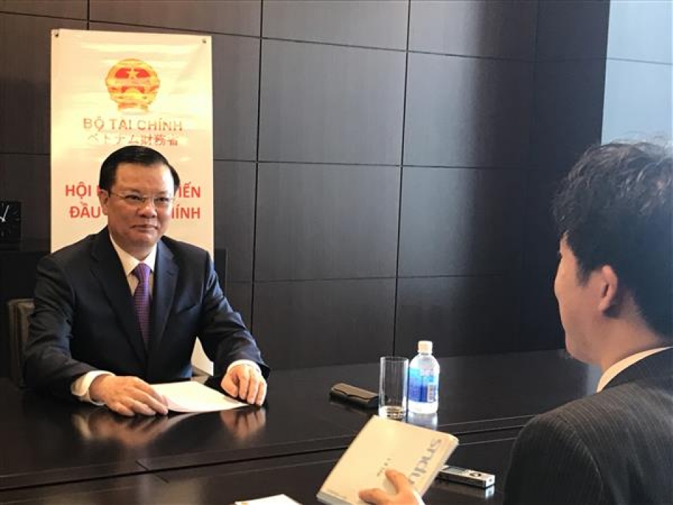minister dinh tien dung committed to issue many policies to attract japanese investors