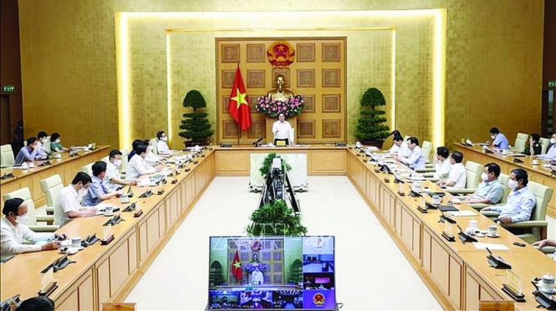 On August 19, 2021, Prime Minister Pham Minh Chinh chaired an online meeting of the Government Standing Committee with Ho Chi Minh City and the provinces of Binh Duong, Dong Nai and Long An on Covid-19 prevention and control. Photo: VNA