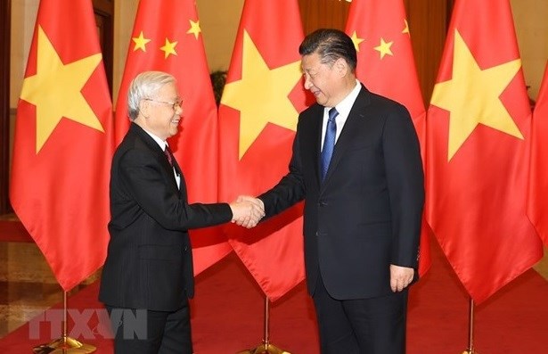 Top Vietnamese, Chinese leaders exchange Lunar New Year greetings hinh anh 1