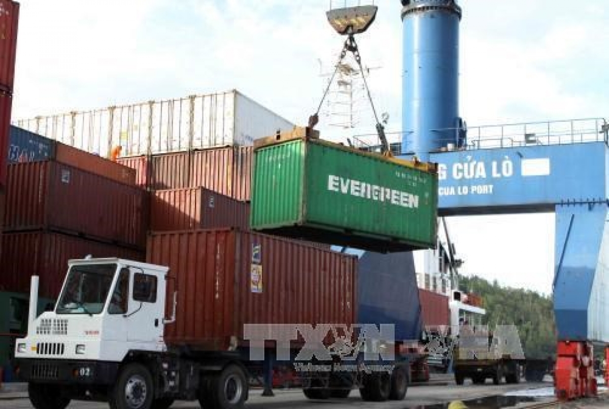 Containers are loaded onto a lorry at Cua Lo Port in Nghe An province