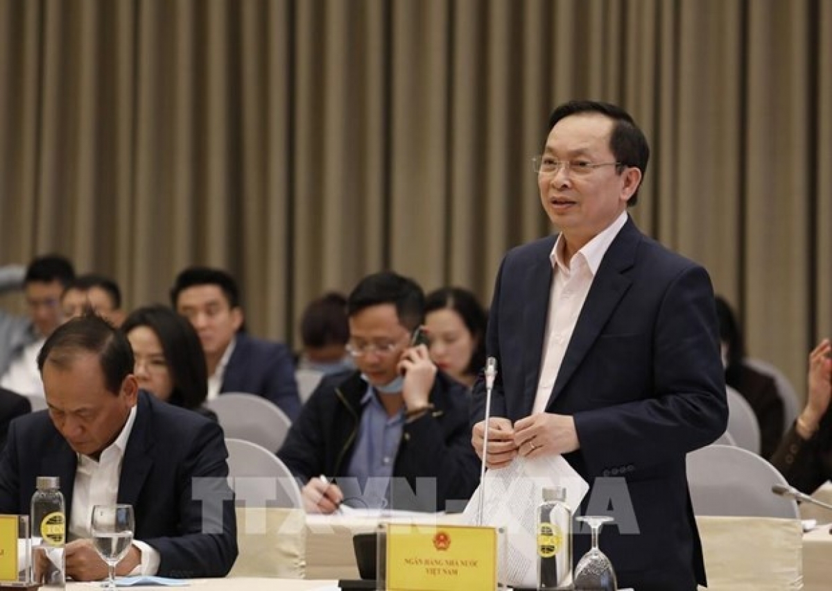 The State Bank of Vietnam (SBV)'s Deputy Governor Dao Minh Tu speaks at the press conference