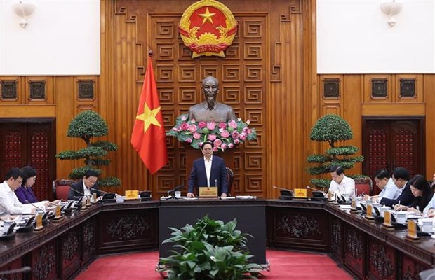PM chairs meeting seeking ways to remove obstacles for production, business hinh anh 1