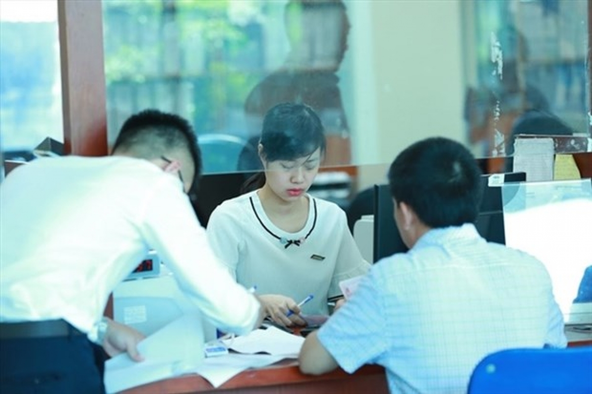Businesses with income of no more than VND200 billion (US$8.58 million) a year are eligible for 30% corporate income tax reduction this year. (Photo: laodong.vn)