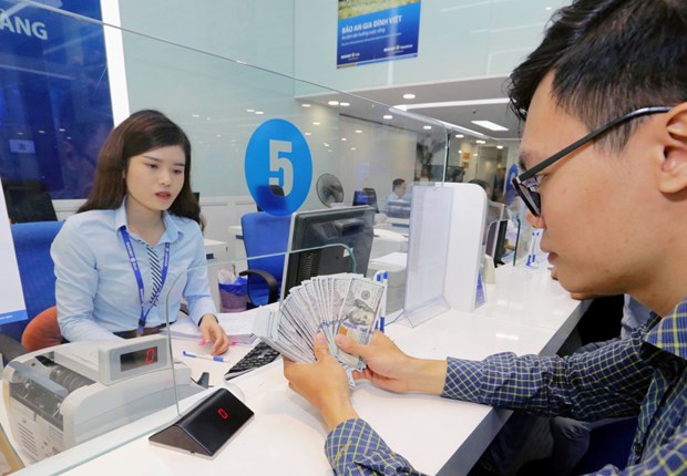 State Bank adjusts USD/VND exchange rate band to 5% hinh anh 1