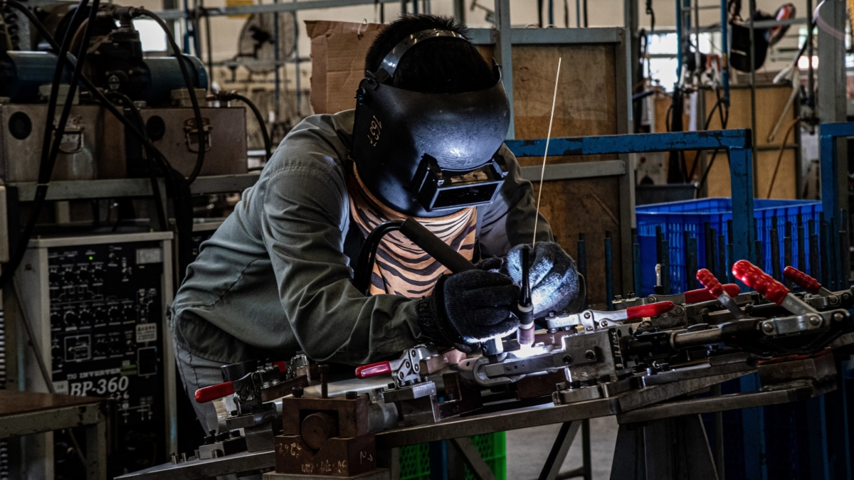 An employee works on a part for Modmo electric bicycles, which are produced in Vietnam and retailed in European markets for about 2,000 euros. (Photo courtesy of Modmo)