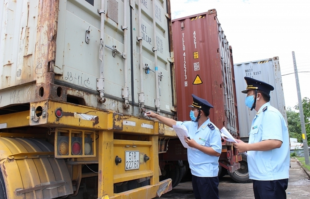 Conducting physical inspection if detecting shipment of goods in transit showing signs of banned goods