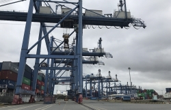 Why do service charges at Cat Lai port increase?