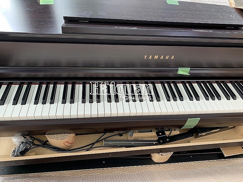 Holding in custody four containers of imported used pianos