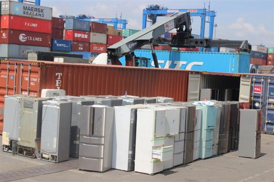 photos about 2 containers of used electric and refrigeration products at cat lai port