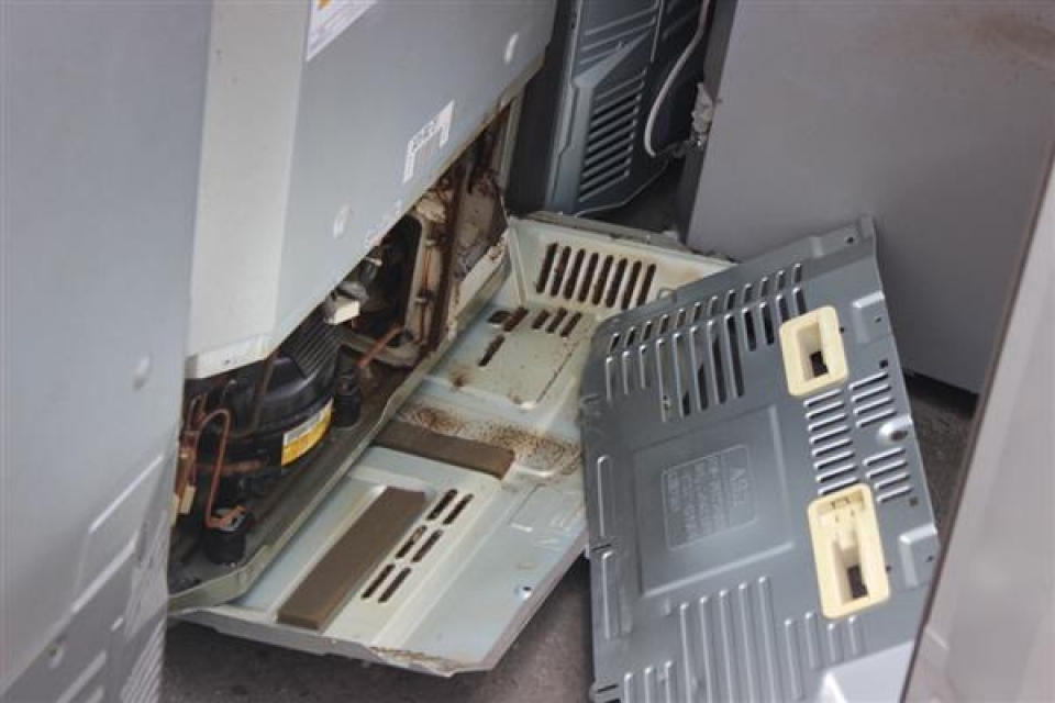 photos about 2 containers of used electric and refrigeration products at cat lai port