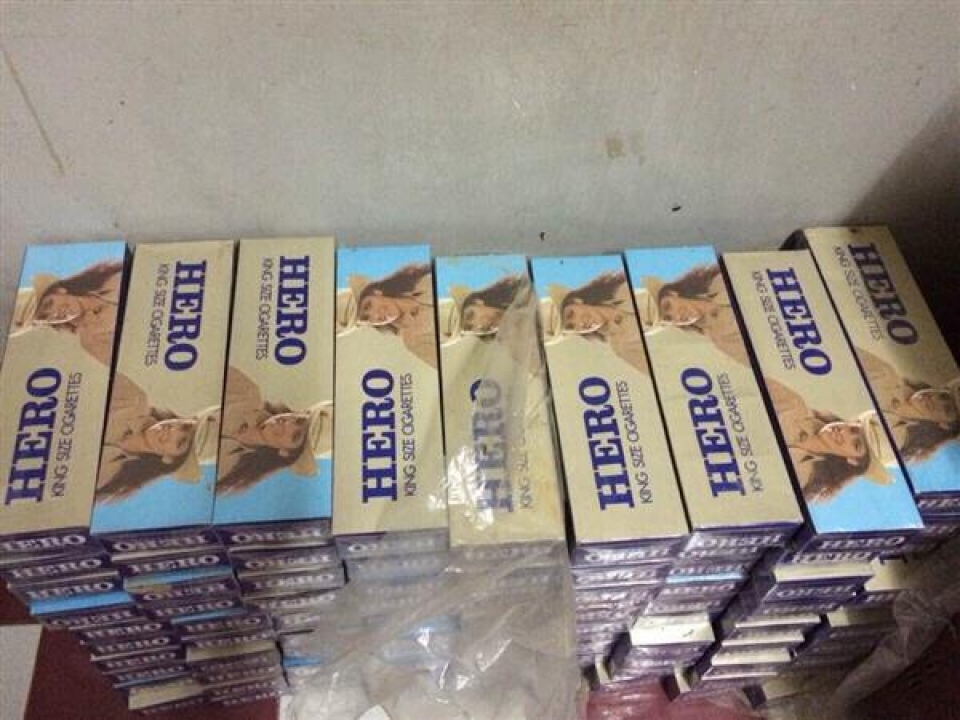 long an arrest nearly 14000 packs of smuggled cigarettes
