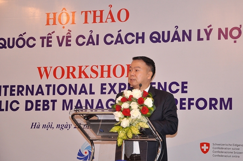 Deputy Minister of Finance Nguyen Duc Chi made a speech at the workshop.