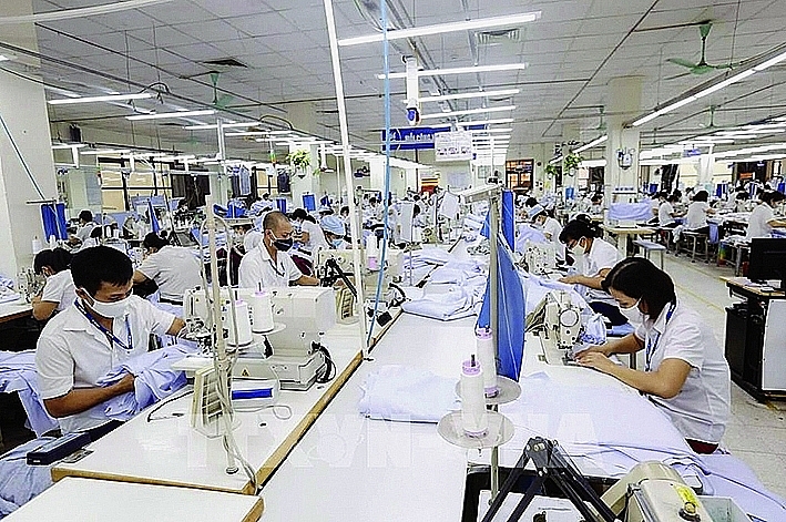 Workers produce textiles at May10